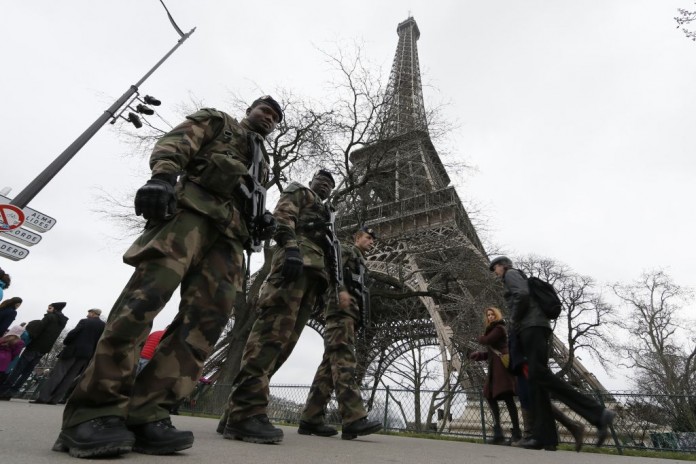French soldiers patrol near the Eiffel Tower in Paris as part of the